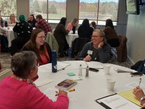 Librarians around a table laughing