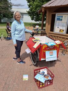Lanna standing next to Menomonie’s book bike.